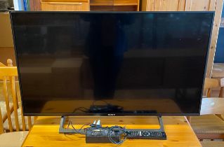 A Sony Bravia 43 inch TV, model KD-XE 8396, date of manufacture 2018, with AC lead and remote.