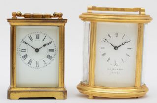 A 20th century Garrard of London brass cased oval carriage clock, 15cm high together with a 20th