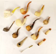 A collection of early 20th century and later cased Meerschaum pipes and cheroot holders.