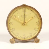 A 20th century Cyma Amic brass cased 8 day travelling clock, 6cm high