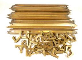 A set of nineteen early 20th century brass pyramid shaped stair rods and thirty eight fittings