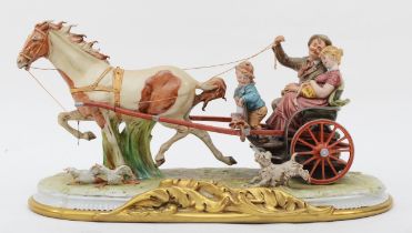 A 20th century Capodimonte painted porcelain figural group, The Carriage, a couple riding in a horse