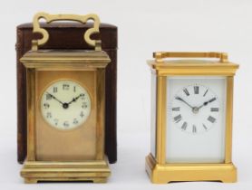 A 20th century brass cased carriage clock, complete with leather carrying box, 15cm high, together