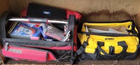 A red Facom work bag with tools, and a Dynamo work bag with unused tools.