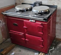 A red AGA BF GC LPG gas fired two oven two hob cooker circa 90s, serial number A0098763.