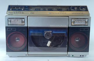 A Sharp portable music system, model VZ-2000E, comprising of tape player, record player and radio.