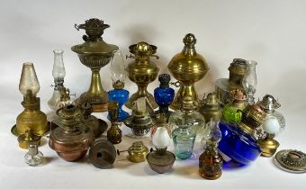 An assortment of 20th century brass and glass oil lamps.