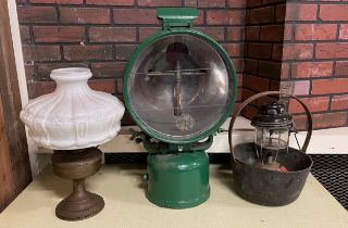 A Tilley FL6 paraffin-powered flood lamp, c.1940's, later green painted, together with an oil lamp