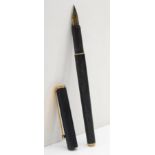 Mont Blanc, a black plunger fill fountain pen with gold plated nib.