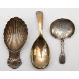 Three silver tea caddy spoons to include a William IV example with thistle decoration, by Joseph