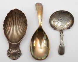 Three silver tea caddy spoons to include a William IV example with thistle decoration, by Joseph