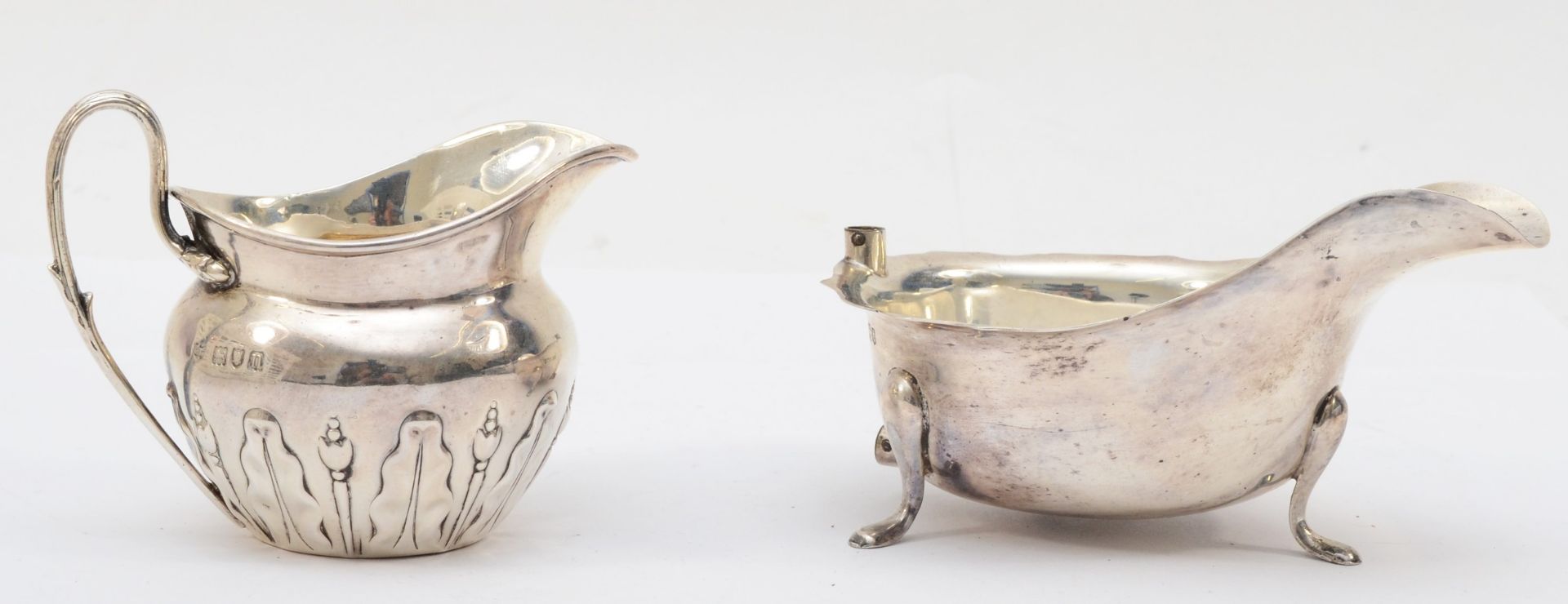 An Edward VII silver cream jug, with embossed floral decoration, by Edward Barnard & Sons Ltd, - Image 2 of 4