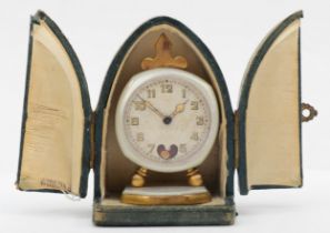 An early 20th century Brevet brass and mother of pearl cased traveling clock, the silvered dial