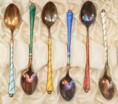 A set of six early 20th century Danish silver and enamel tea spoons, 52gm, boxed.