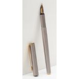 Mont Blanc, a brushed stainless steel plunger fill fountain pen with 585 gold nib.