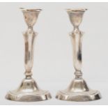 A pair of George V silver loaded candle sticks, Birmingham 1922, 20cm,