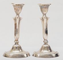 A pair of George V silver loaded candle sticks, Birmingham 1922, 20cm,