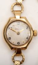 Omega, a 9ct gold cased ladies key wind wrist watch, the silvered dial set with Arabic numerals,