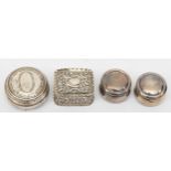 Four silver pill boxes to include a Victorian embossed foliate scroll example, London 1898, 4 x 3.