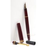 Mont Blanc Meisterstuck, a burgundy cartridge fountain pen, with 14K gold nib, cap holder broken,