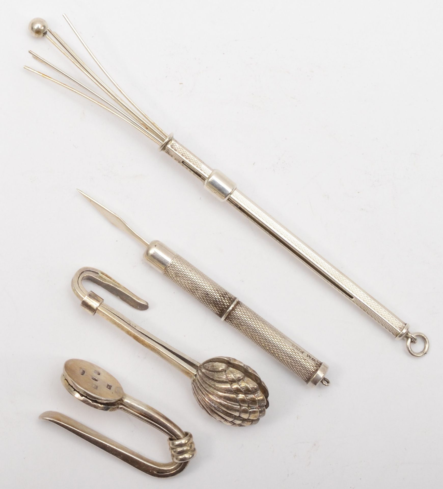 A group of silver to include a swizzle stick, Birmingham 1978, a silver tooth pick and two napkin - Image 2 of 2