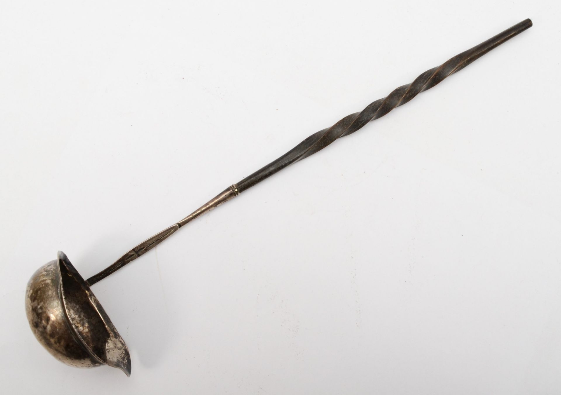 A Georgian silver toddy ladle, with whale bone twist handle and chased decoration, 32.5cm.