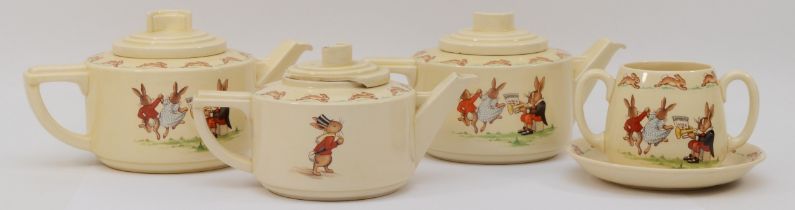 Royal Doulton Bunnykins; Lambeth Walk pattern; comprising of three teapots and lids (one a/f) and