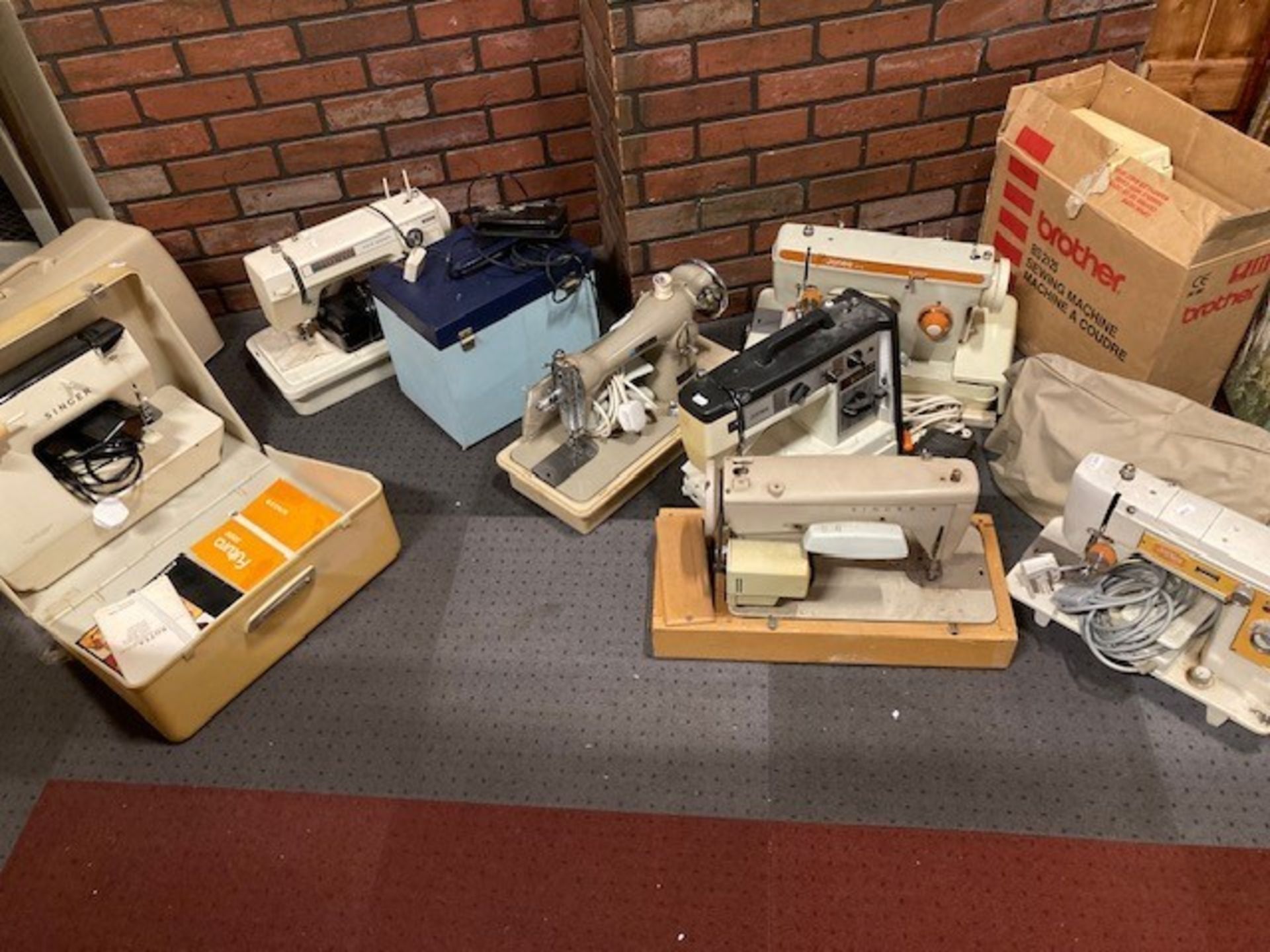 Five assorted cased sewing machines to include New Home, Singer and Regency (5)