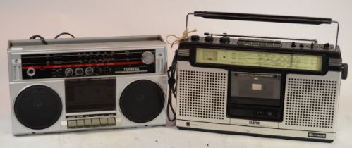 A Toshiba portable radio/ cassette player, model RT-6015, together with a Hitachi example, model