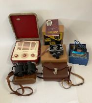 A 1960s Russian cine camera, with outer box, leather carry case, instructions and original receipt