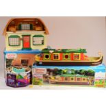 Sylvanian Families; comprising of a canal boat (boxed) a Meadow Croft cottage set (Boxed) together