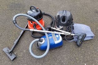 A Sealy wet & dry industrial vacuum cleaner, together with an Edward hoover and a Miele vacuum