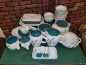 A contemporary Denby Green Wheat pattern stoneware part dinner service.