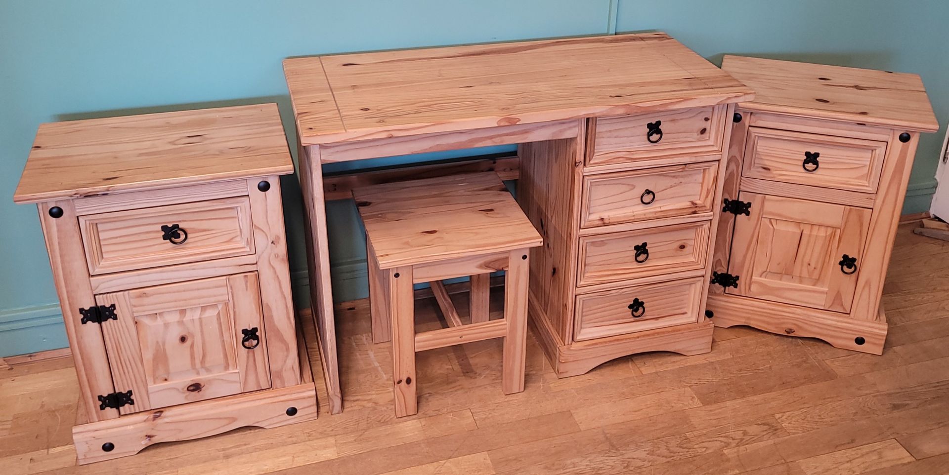 Four pieces of contemporary stripped pine comprising of a dressing table/ desk with five drawers,