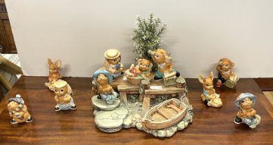 Pendelfin; a collection of twenty four rabbits and two display stands to to include Christmas Isla