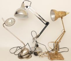 An early 20th century anglepoise table lamp, together with two modern examples. (3)