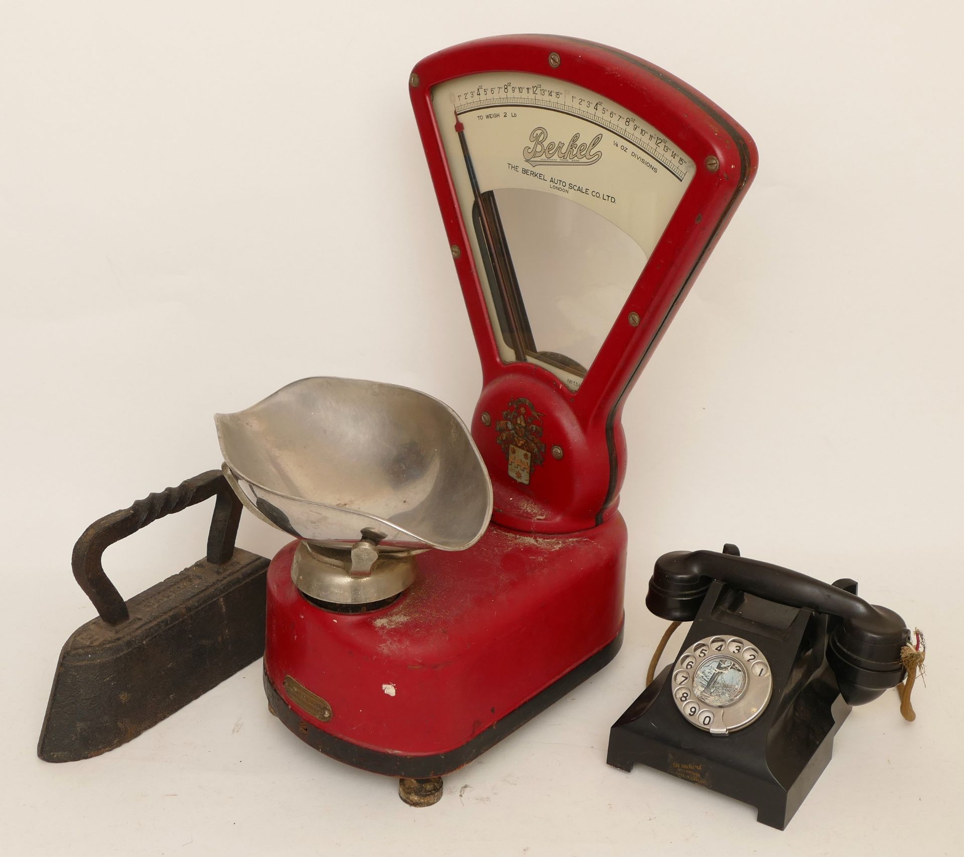 A mid 20th century countertop set of scales by Berkel of London, together with a solid cast iron,