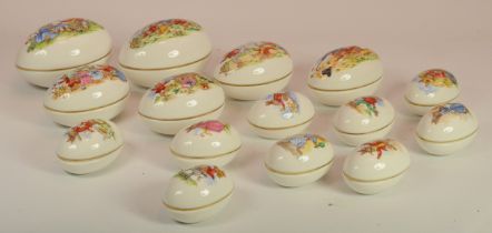 Royal Doulton Bunnykins; fifteen egg shaped lidded trinket boxes with differing designs.