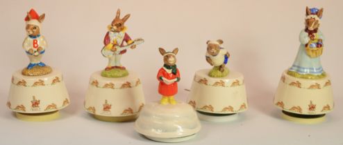 Royal Doulton Bunnykins; five musical figures comprising of King of the Road, Carol Singer, Fly Me