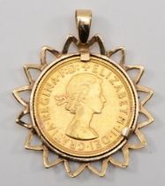 A Elizabeth II full sovereign in a gold mount, 1958, unmarked, 10.9gm.