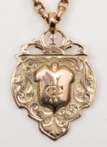 A George V 9ct gold shield watch fob, by William Dingley, Birmingham 1910, with chased foliate