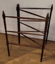 A 19th century mahogany bamboo effect two fold floor standing clothes horse, raised on turned