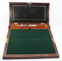 A 19th century mahogany and brass bound twin handled writing slope, opening to reveal pull down