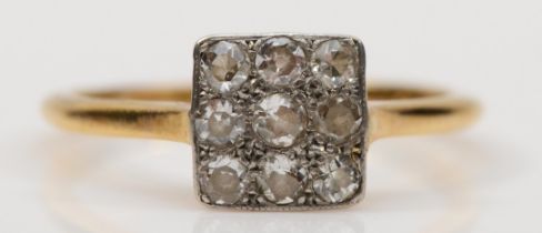 An 18ct gold and platinum set old cut diamond ring, central squared panel set with nine diamonds, M,