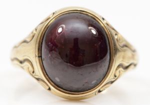 A George VI 9ct gold filled gentleman's foil backed garnet signet ring, makers mark CG, Birmingham