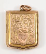 An Edward VII 9ct gold shield shaped locket, by Albert Jackson, Birmingham 1903, with chased foliate