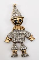 A vintage 9ct gold articulated clown pendant, with sapphire eyes, eight cut diamond body and hat,