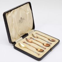 An Art Deco silver and polychrome enamel set of six coffee spoons, 10cm, 63gm, case