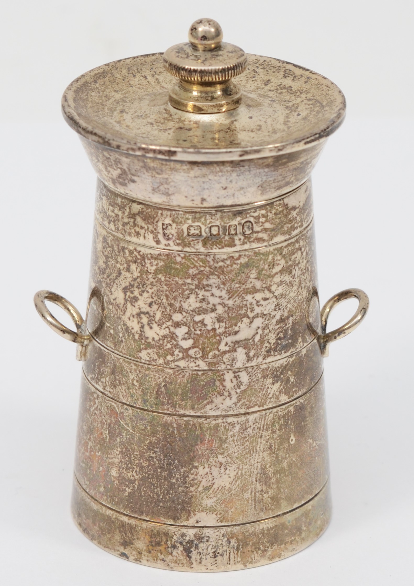 A novelty silver pepper grinder, London 1934, Jubilee mark, in the form of a milk churn, 9cm, 136gm