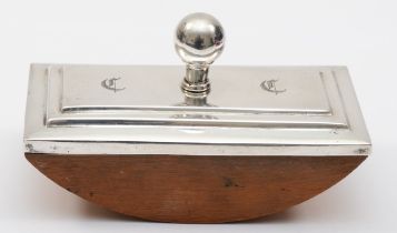 An early 20th century silver ink blotter, unmarked, with stepped rectangular mount, and chased